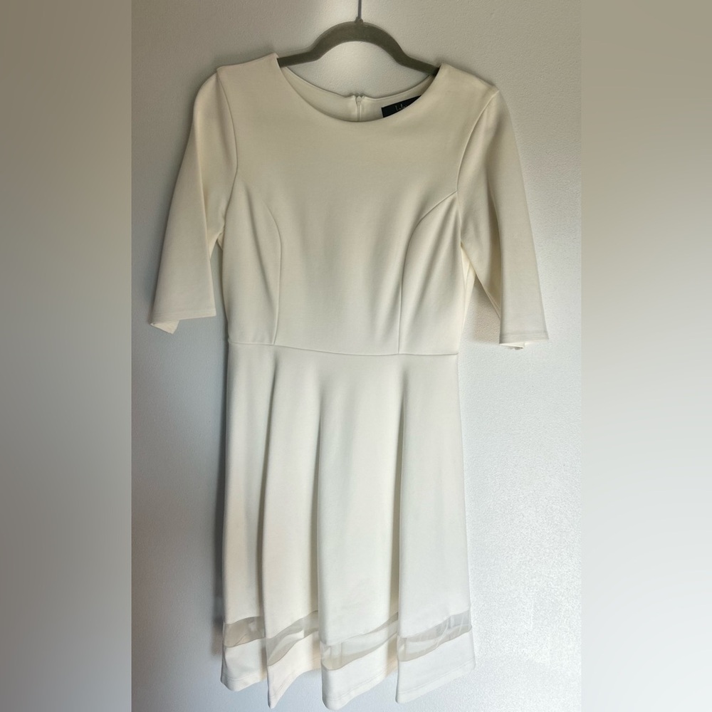 Beautiful off white dress. Perfect for your wedding shower/ rehearsal dinner.